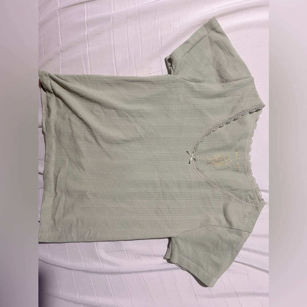 green tshirt with cute lace lining and a little bow